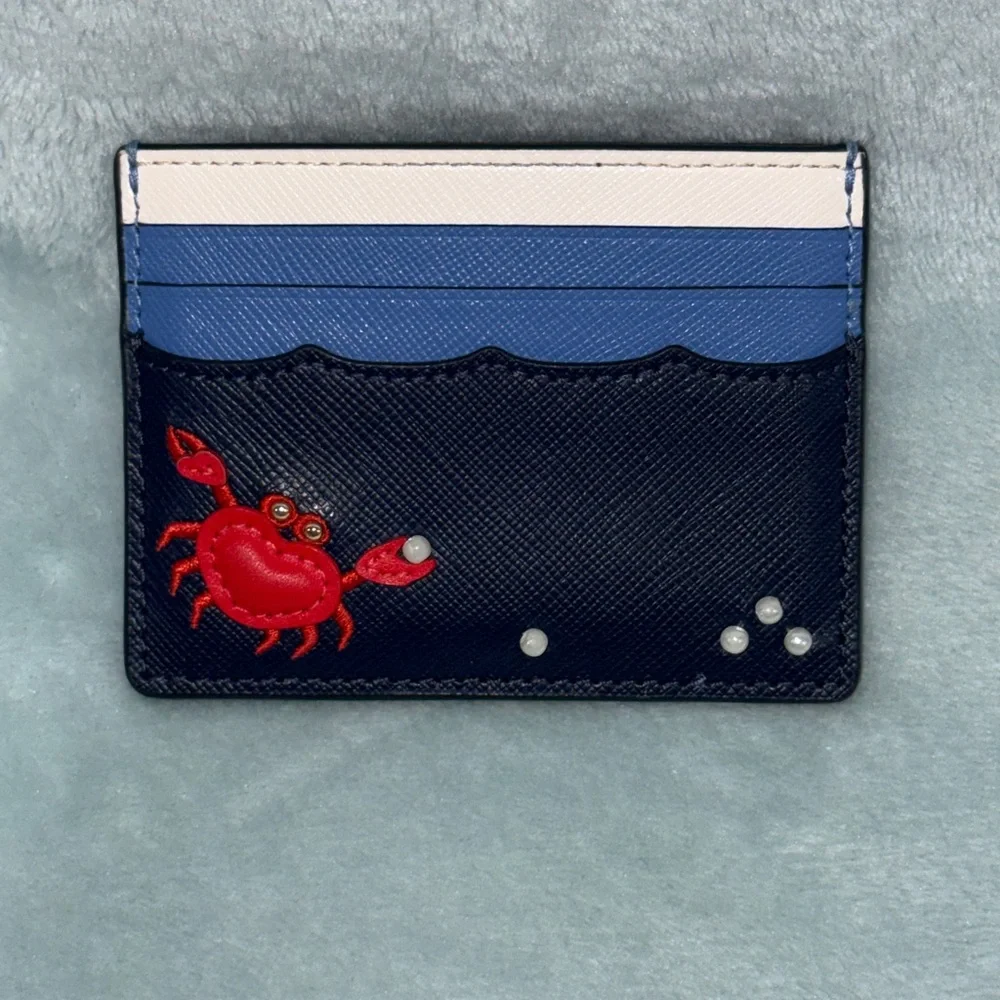 kate spade New York Pinch Me Crab Pearl Beach Blue small slim card holder.